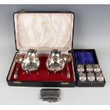 A pair of Elizabeth II silver sauceboats and a pair of silver sauce ladles, Sheffield 1964 and