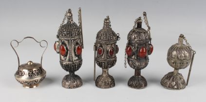 A group of three white metal and plated scent bottles and stoppers, possibly Yemeni or Ethiopian,