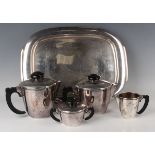 An Art Deco WMF plated four-piece tea set of circular tapering from with ebonized handles and
