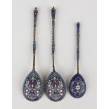 A pair of late 19th century Russian silver gilt and cloisonné enamel spoons, 84 zolotnik, each fig