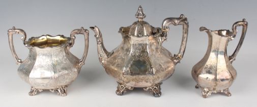 An early Victorian silver three-piece tea set of octagonal squat baluster form, engraved with panels