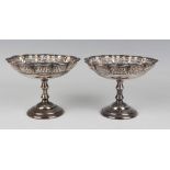 A pair of George VI silver bonbon tazze, each circular lobed bowl with pierced sides and cast rim,