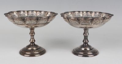 A pair of George VI silver bonbon tazze, each circular lobed bowl with pierced sides and cast rim,