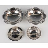 A pair of George VI silver circular bonbon tazze, each with lobed and pierced outswept rim, on a