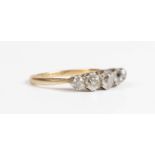 A gold, platinum and diamond five stone ring, claw set with a row of graduated old mine cut