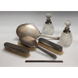 A George VI silver five-piece dressing table set with engine turned decoration, comprising hand