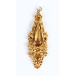 A Victorian gold and citrine pendant, formerly an earring, mounted with a large pear shaped
