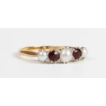 A gold, garnet and half-pearl ring, claw set with two circular cut garnets alternating with three