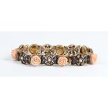 A sapphire, half-pearl and coral bracelet, formed as a row of coral flowerheads with sapphire and
