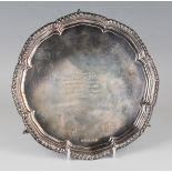 An Elizabeth II silver circular card salver, inscription engraved within a gadrooned rim, on