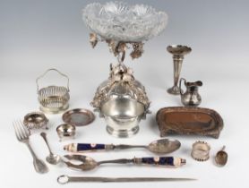 A collection of assorted plated items, including a Victorian centrepiece with vine supports and