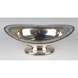 An Edwardian silver oval bowl with pierced outswept rim, on an oval foot, Sheffield 1902 by Atkin