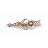 A Murrle Bennett & Co gold and seed pearl brooch, designed as a floral and foliate spray,