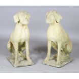 A pair of 20th century composition stone garden models of seated dogs, height 75cm.Buyer’s Premium
