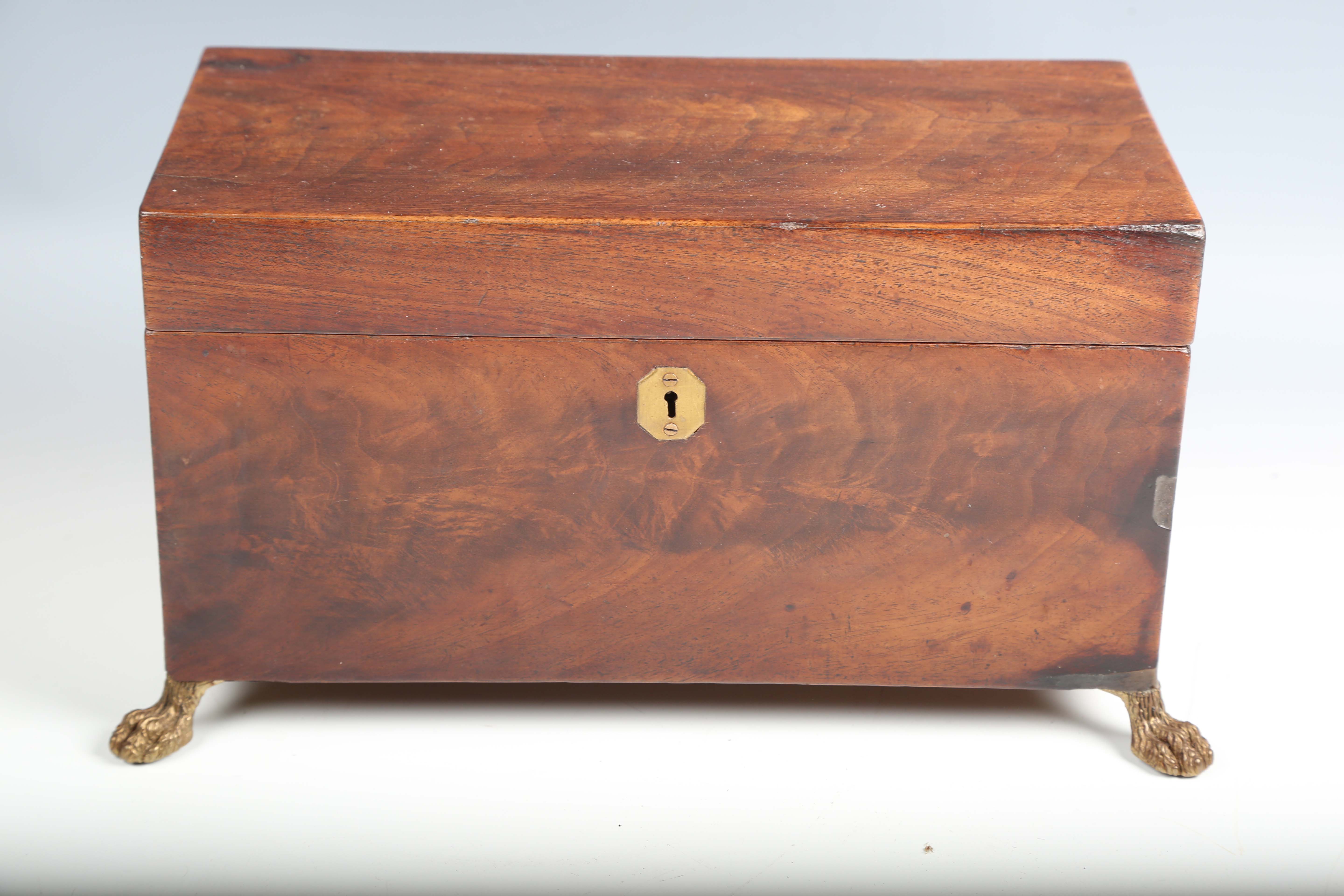 A Regency figured mahogany tea caddy with lion mask ring handles and claw feet, width 34cm.Buyer’s - Image 8 of 12