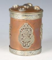 A 20th century Tibetan copper and nickel mounted cylindrical jar and cover, the lid inset with