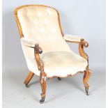 A mid-Victorian walnut showframe open armchair, raised on carved cabriole legs, height 93cm, width