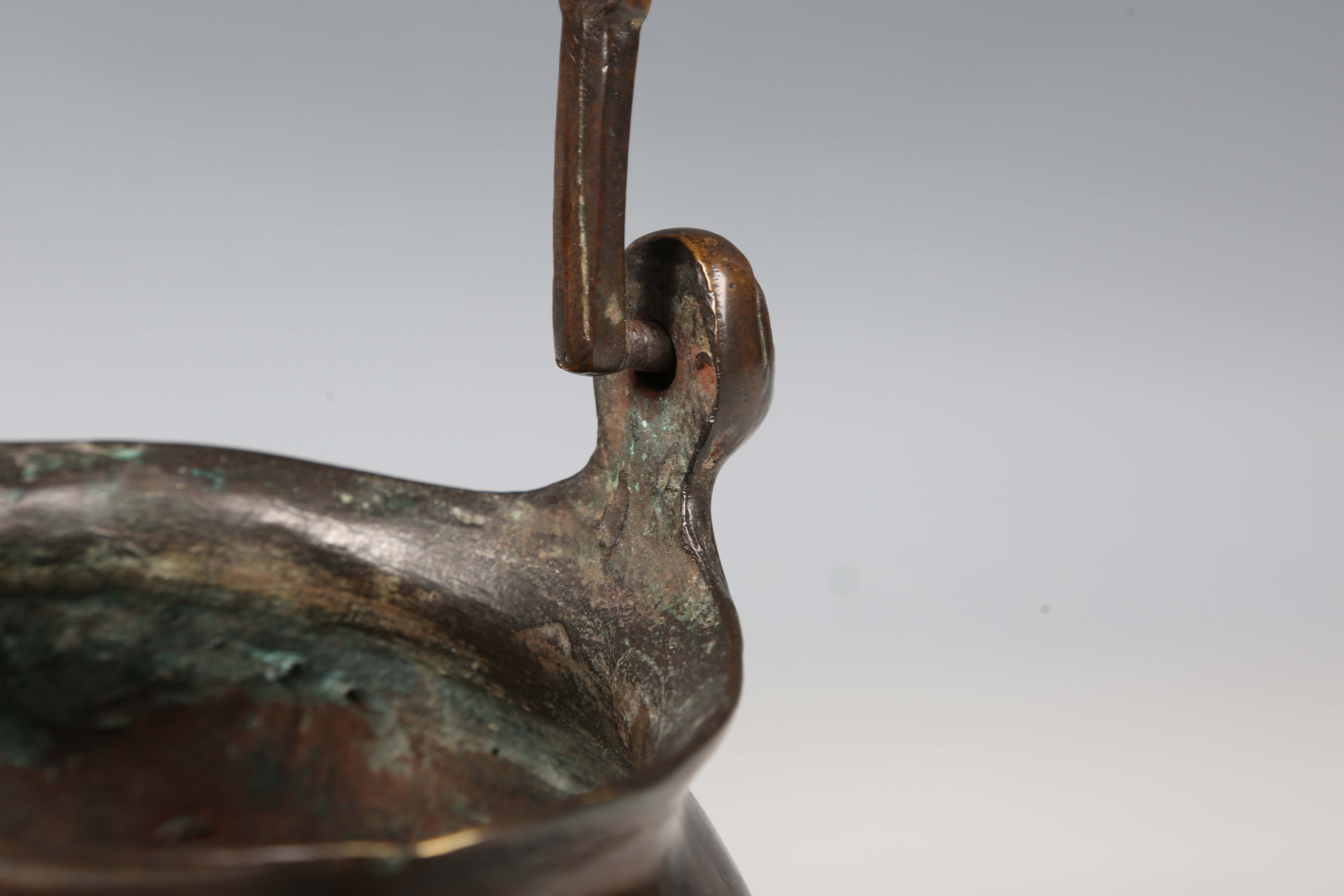 A 16th century Flemish patinated bronze lavabo, the swing handle above two female mask lugs, the - Image 8 of 10