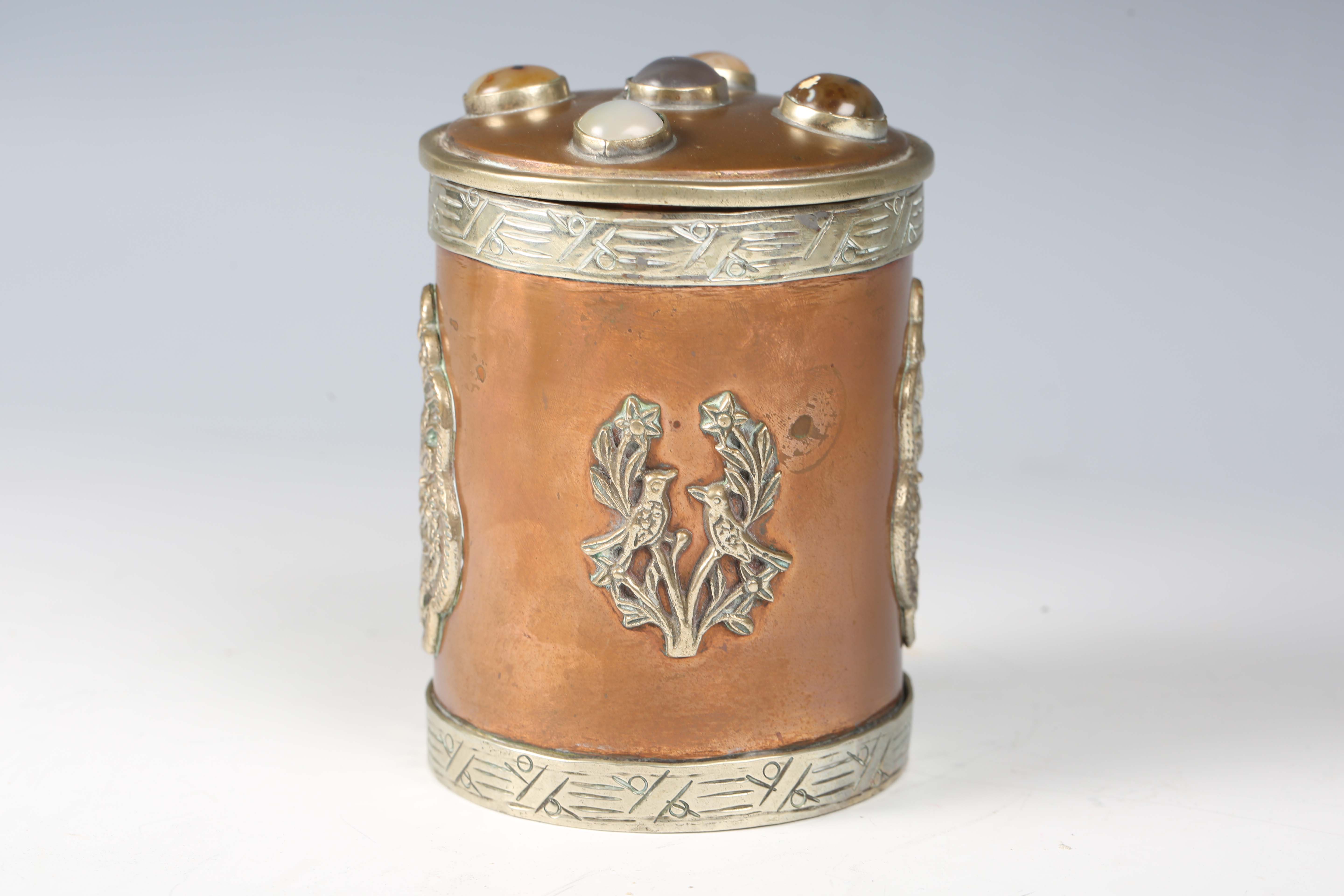A 20th century Tibetan copper and nickel mounted cylindrical jar and cover, the lid inset with - Image 6 of 8