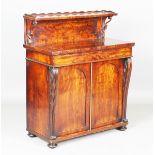 A Regency mahogany chiffonier, the shelf back and single frieze drawer above a pair of arched