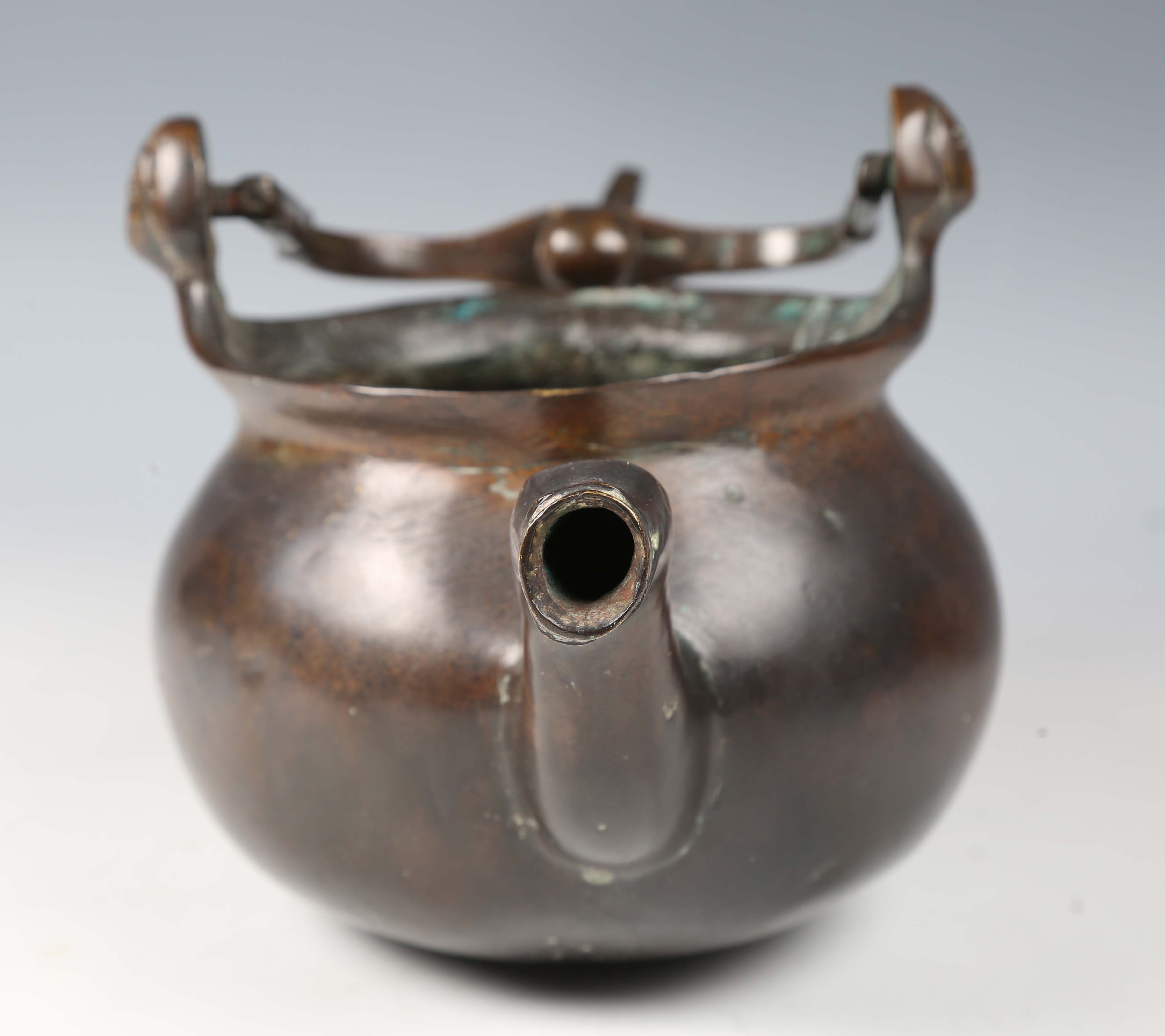 A 16th century Flemish patinated bronze lavabo, the swing handle above two female mask lugs, the - Image 4 of 10