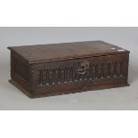 A 17th century oak box with carved fluted sides, height 19cm, width 58cm, depth 35cm.Buyer’s Premium