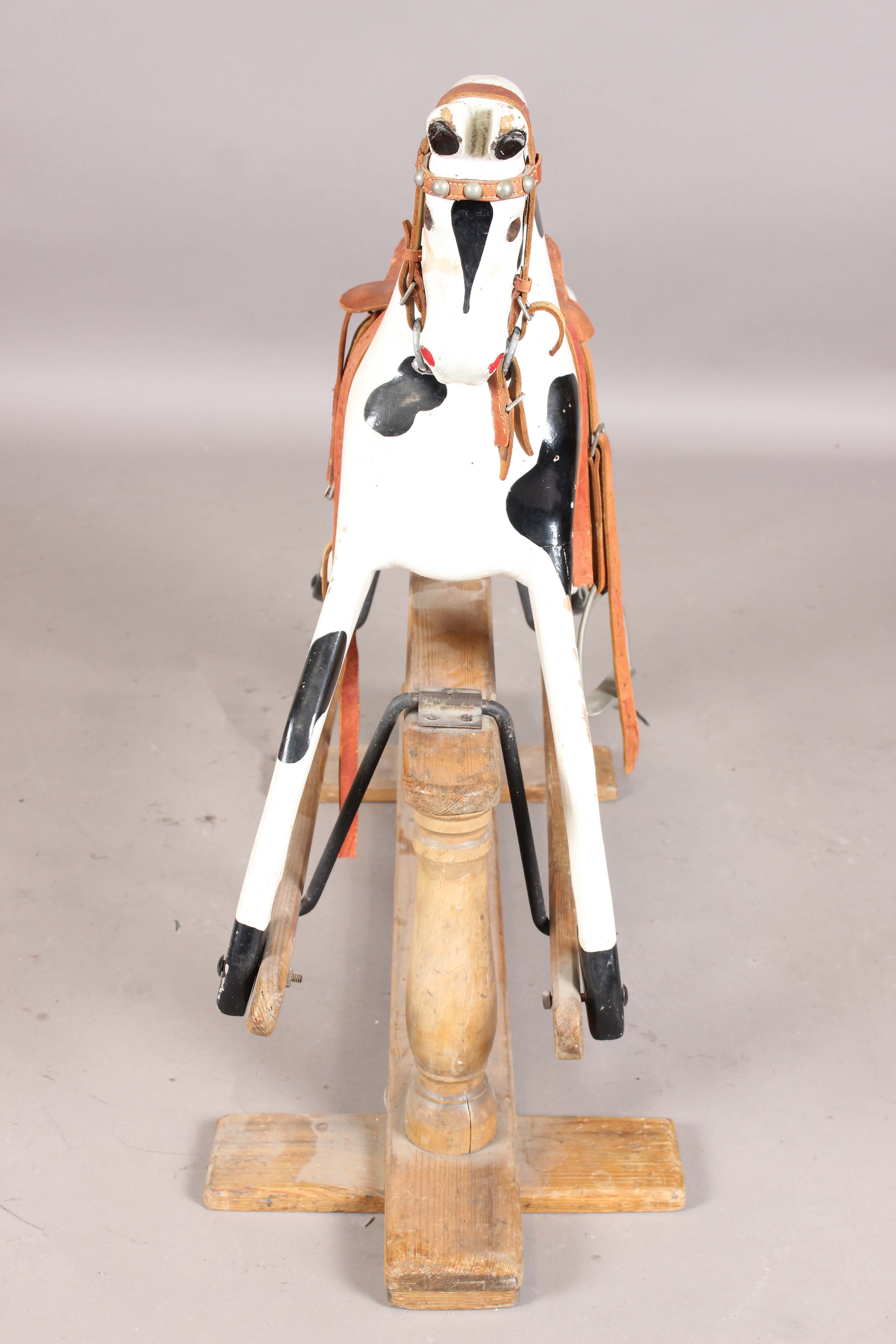 A 19th century carved and painted wooden rocking horse with later leather saddle and pine base, - Image 10 of 15