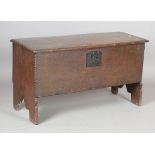 A Charles II oak six-plank boarded coffer, the lid with original wire hinges, height 53.5cm, width