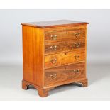 An early 20th century George III style mahogany chest, fitted with a brushing slide and four