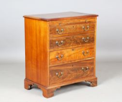 An early 20th century George III style mahogany chest, fitted with a brushing slide and four