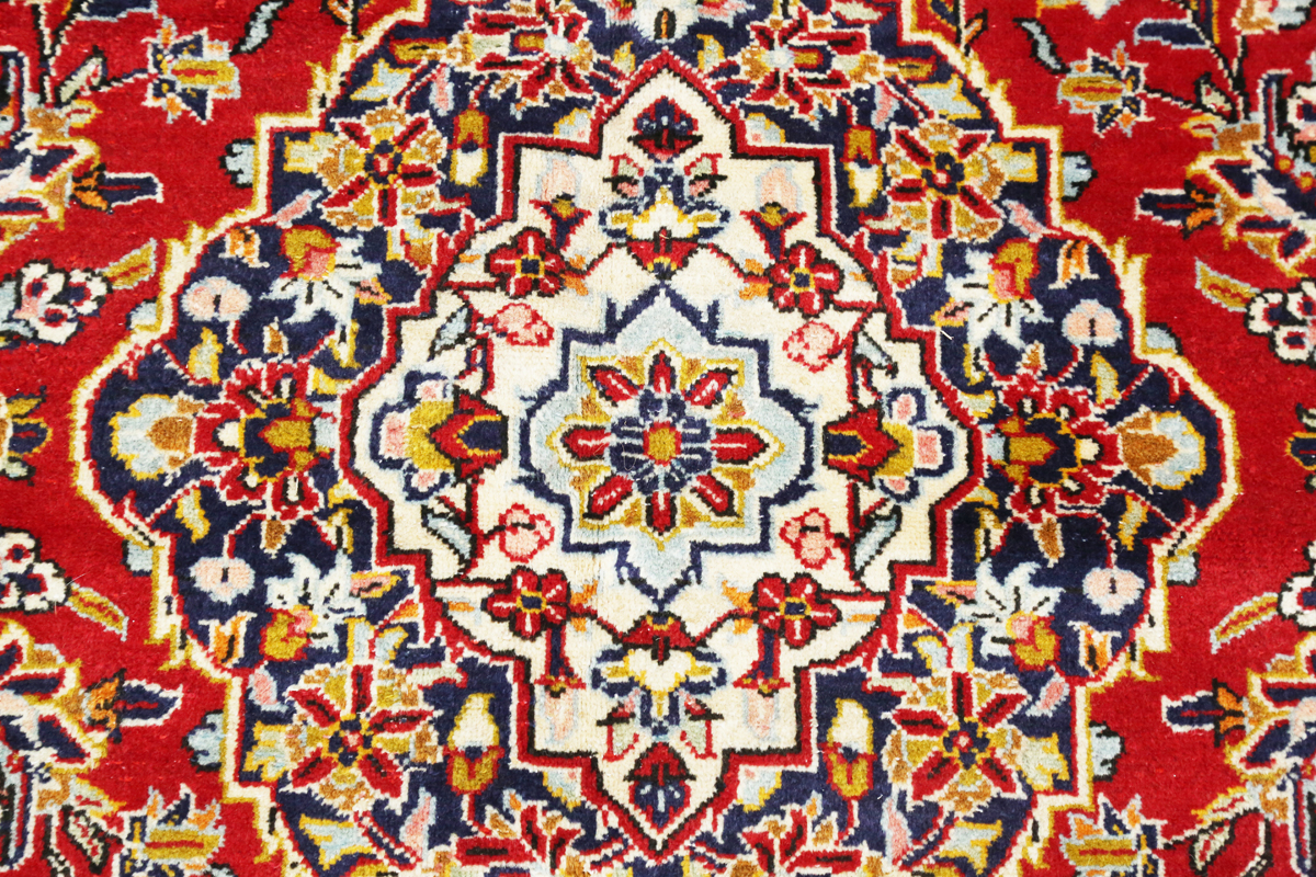 A Kashan carpet, Central Persia, late 20th century, the red field with a shaped medallion, within - Image 7 of 7