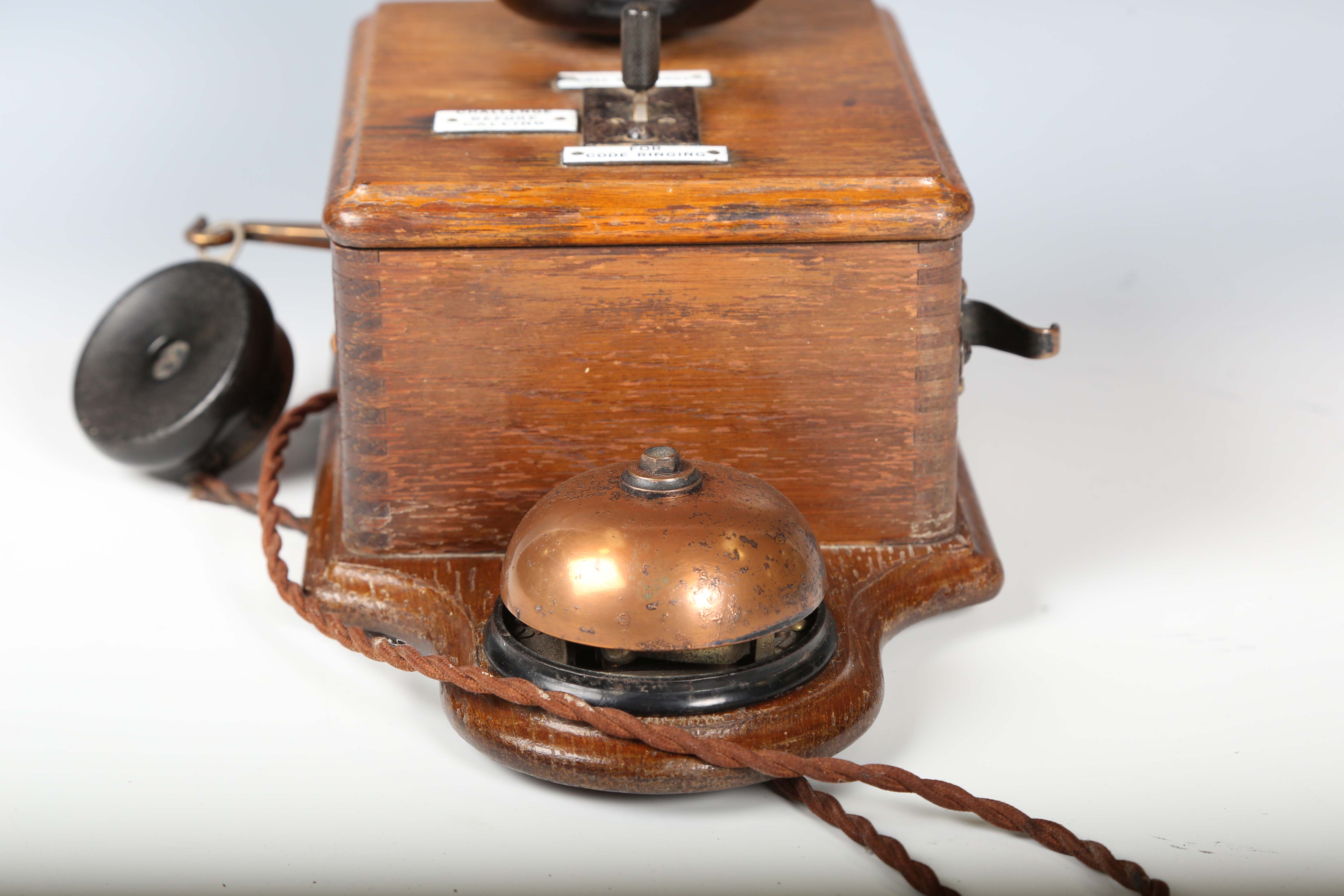 An early 20th century oak cased wall telephone, possibly from a railway, the front with applied - Image 5 of 10