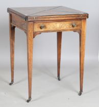 A late Victorian rosewood and inlaid envelope card table, fitted with a drawer, on square tapering