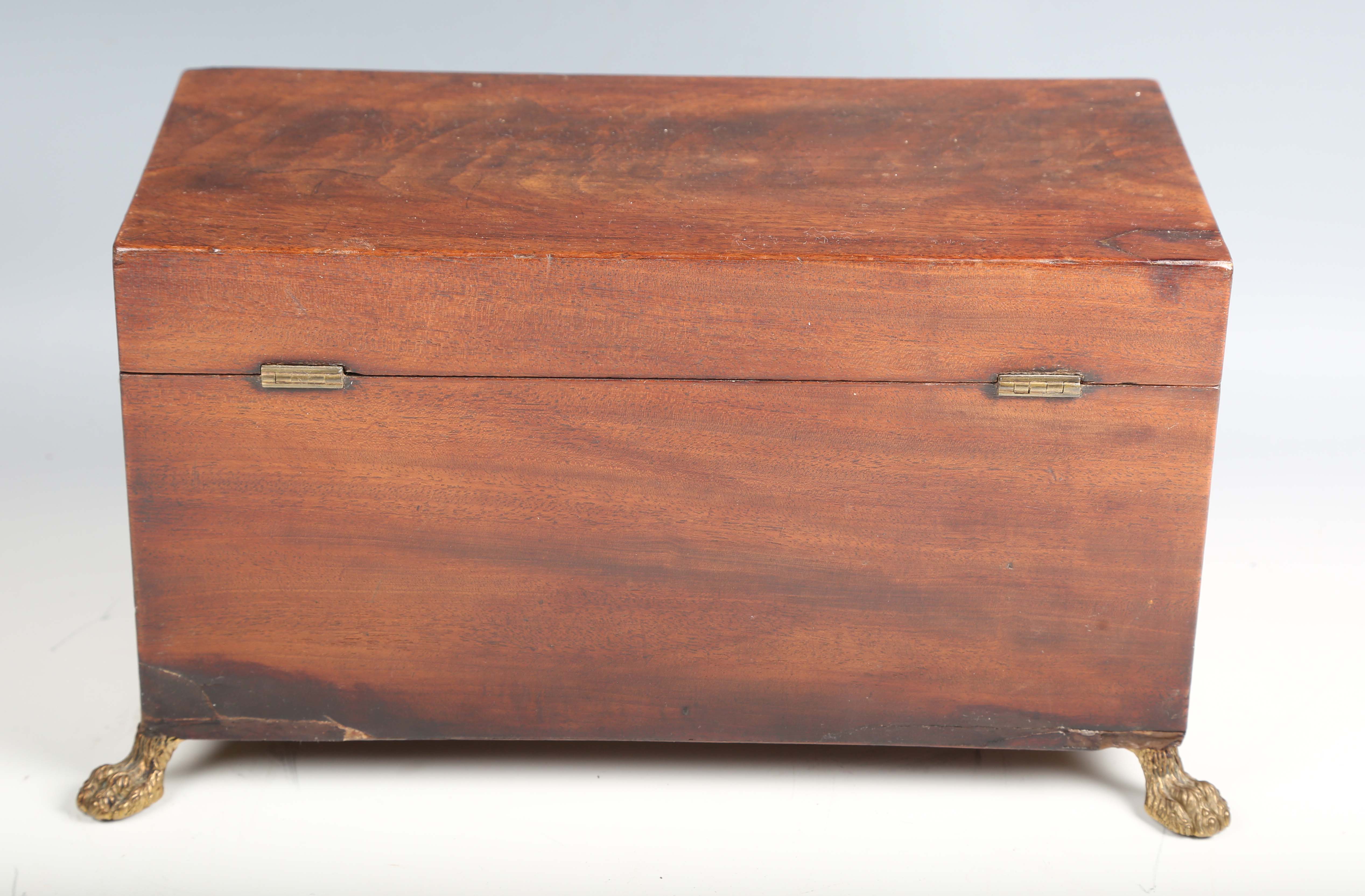 A Regency figured mahogany tea caddy with lion mask ring handles and claw feet, width 34cm.Buyer’s - Image 5 of 12