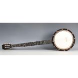 An early 20th century five-string banjo by Butler, Haymarket, London, length 90cm, cased.Buyer’s