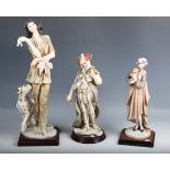A group of three modern Italian resin figures by Florence, including 'The Happy Fiddler', height