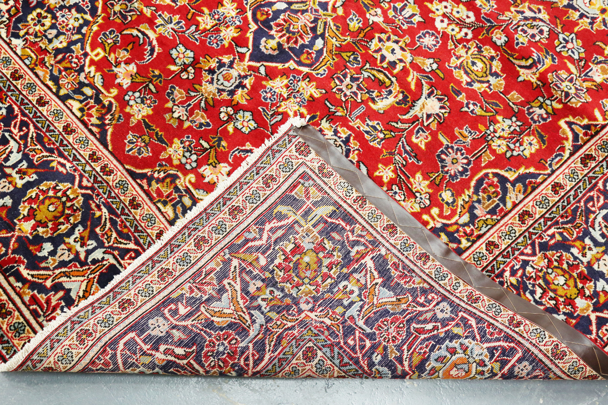 A Kashan carpet, Central Persia, late 20th century, the red field with a shaped medallion, within - Image 2 of 7