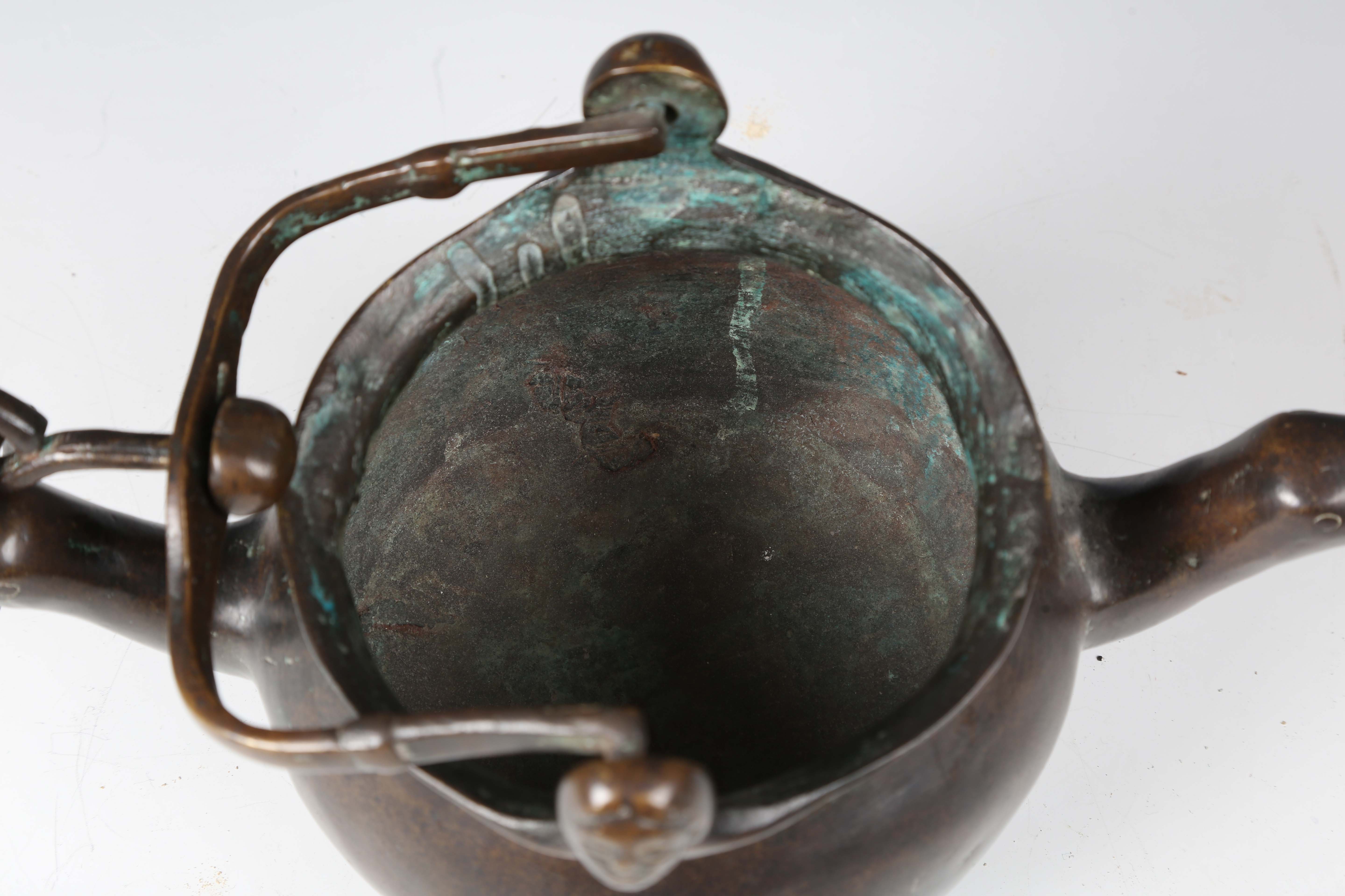 A 16th century Flemish patinated bronze lavabo, the swing handle above two female mask lugs, the - Image 2 of 10