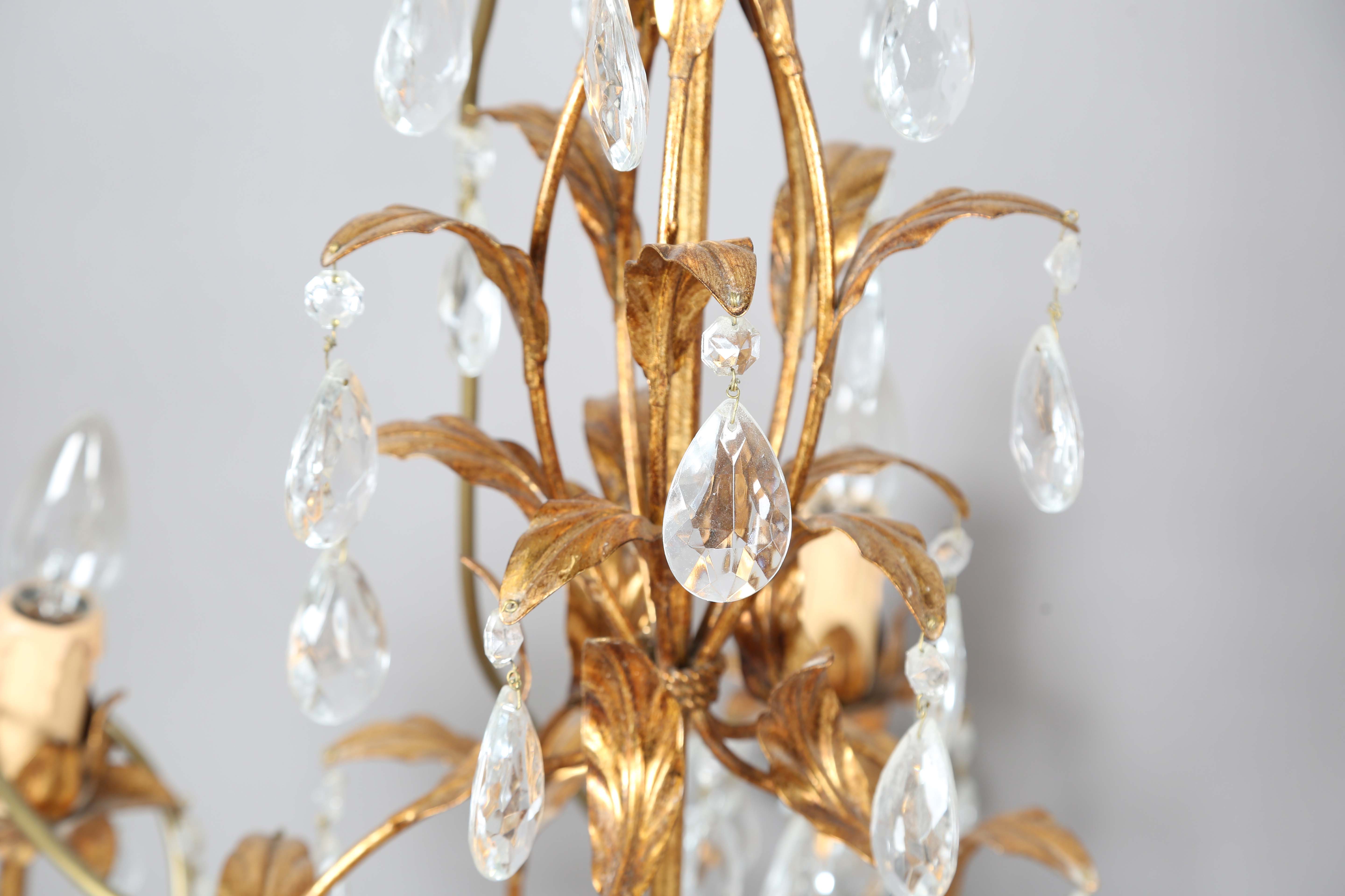 A 20th century gilt metal and cut glass five-light chandelier, height 60cm, width 55cm.Buyer’s - Image 8 of 9
