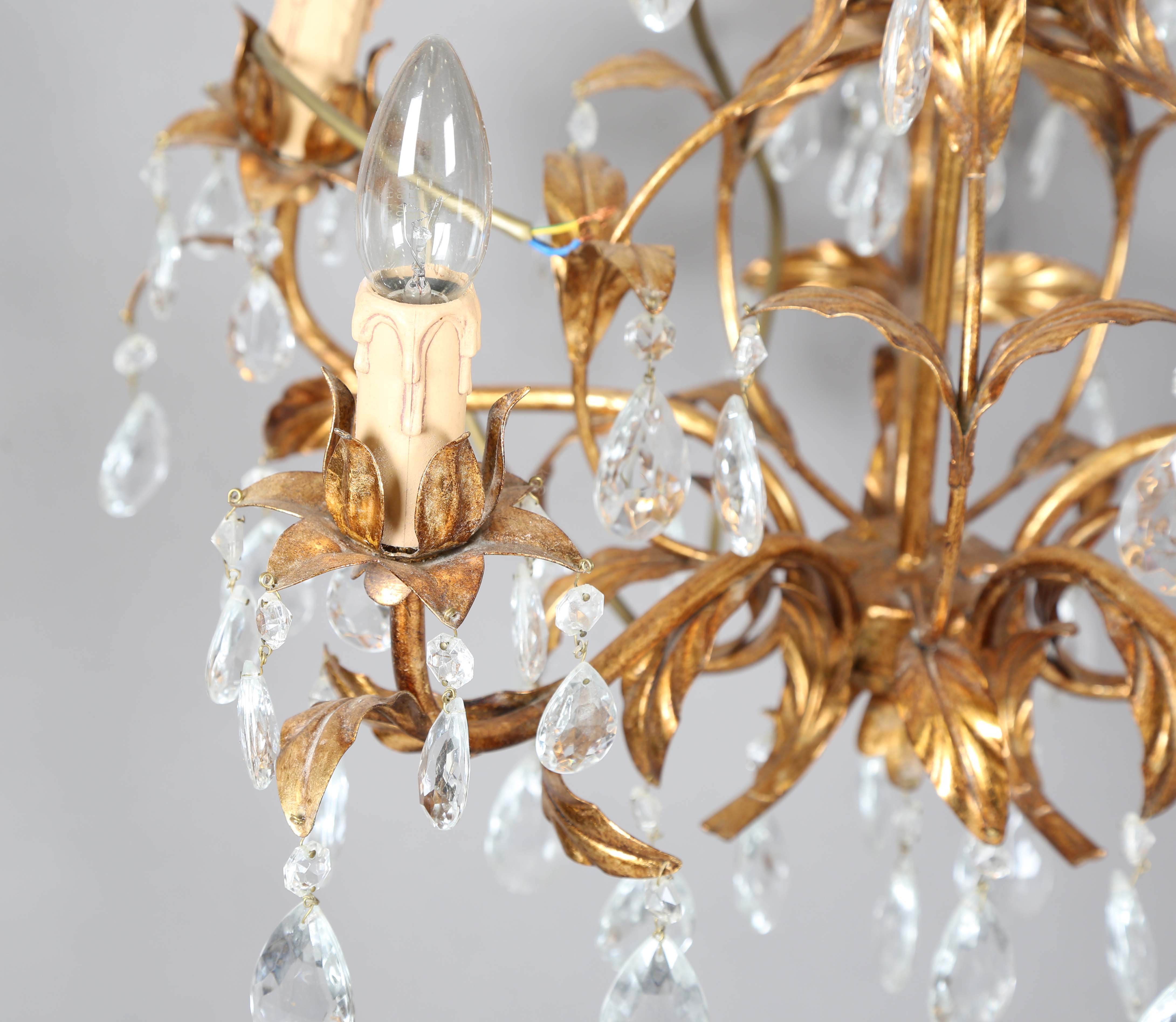 A 20th century gilt metal and cut glass five-light chandelier, height 60cm, width 55cm.Buyer’s - Image 4 of 9