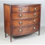 A George III mahogany bowfront chest with projecting corners and reeded columns, the two short and