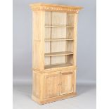 A modern oak bookcase cabinet, the open shelf above a slide and two doors, height 202cm, width