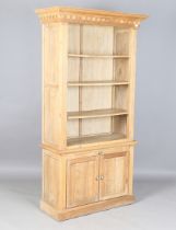 A modern oak bookcase cabinet, the open shelf above a slide and two doors, height 202cm, width