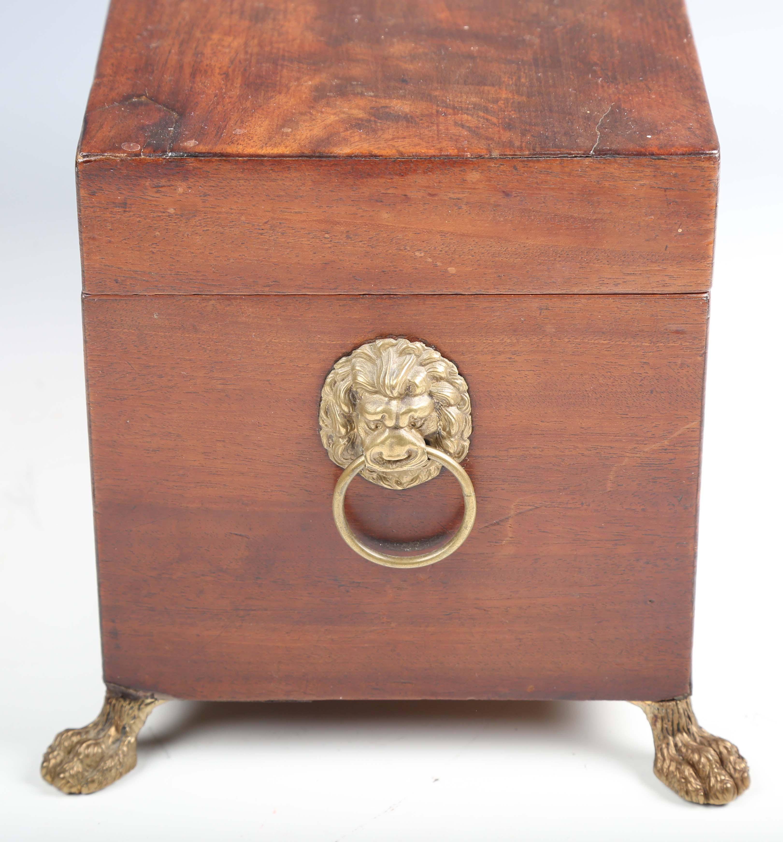 A Regency figured mahogany tea caddy with lion mask ring handles and claw feet, width 34cm.Buyer’s - Image 2 of 12