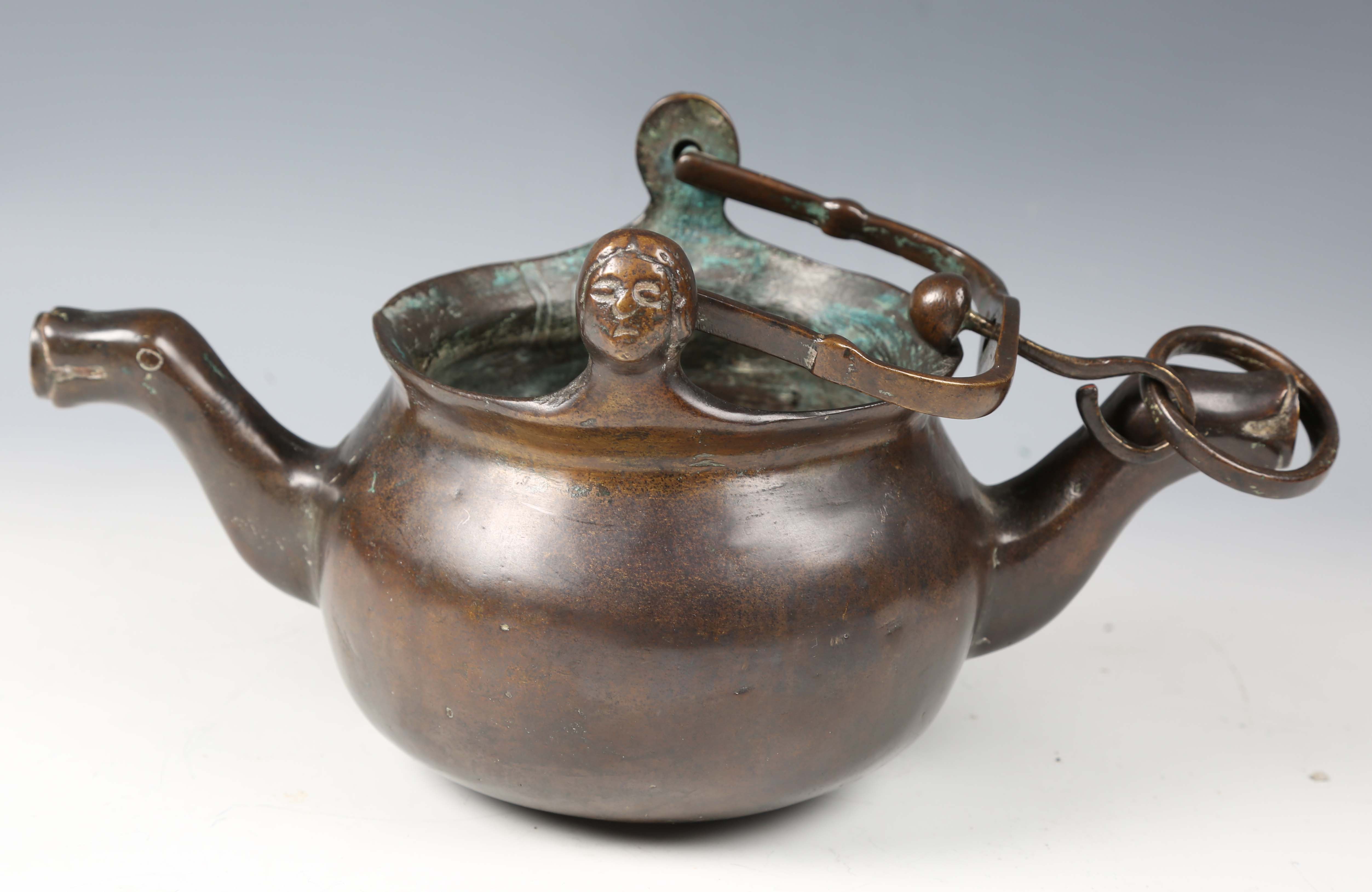 A 16th century Flemish patinated bronze lavabo, the swing handle above two female mask lugs, the - Image 5 of 10