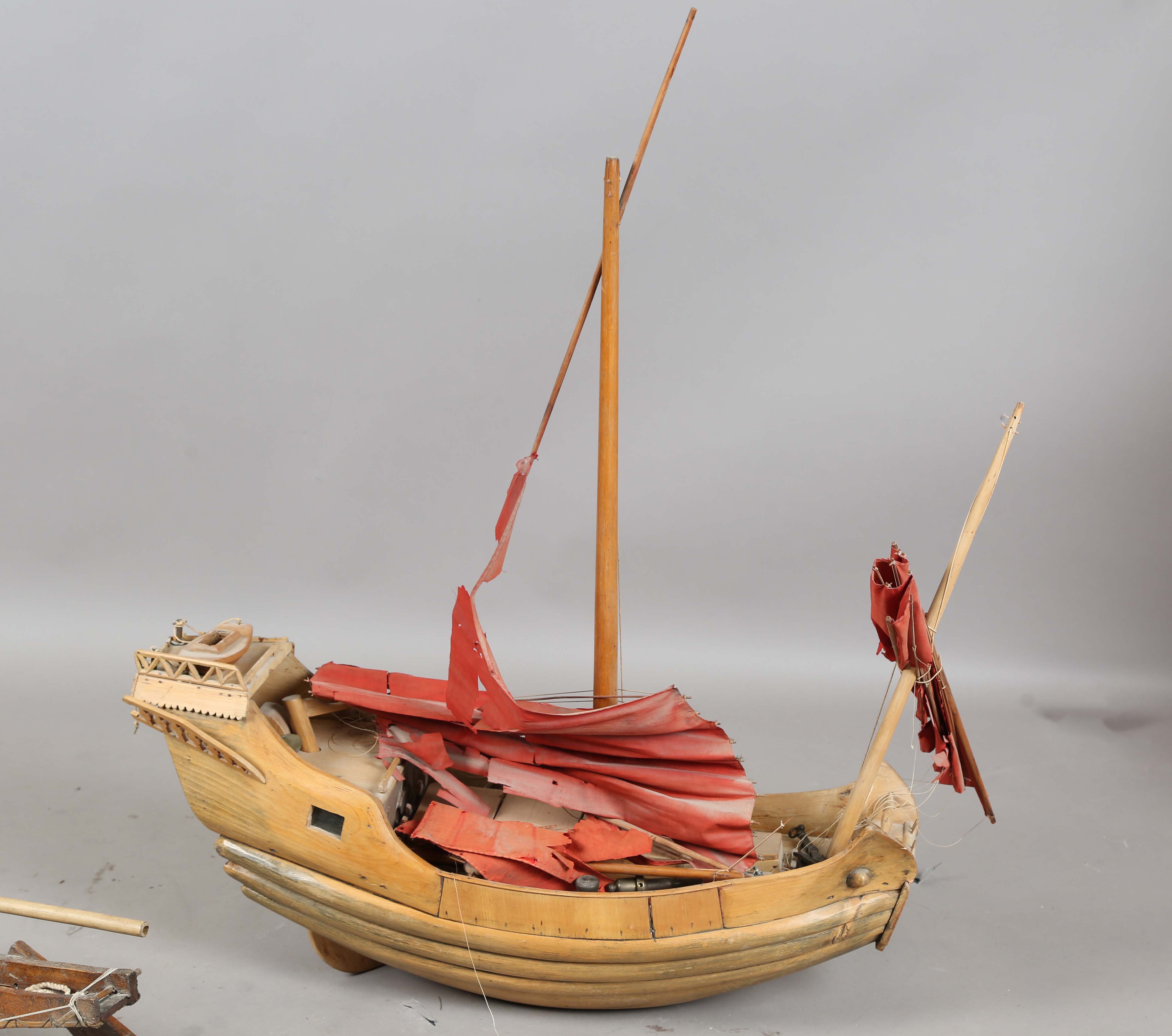 An early 20th century scratch-built softwood model of a boat, detailed with two brass cannons and - Image 9 of 13