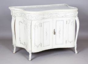 A mid-19th century French white painted marble-topped side cabinet of serpentine outline with