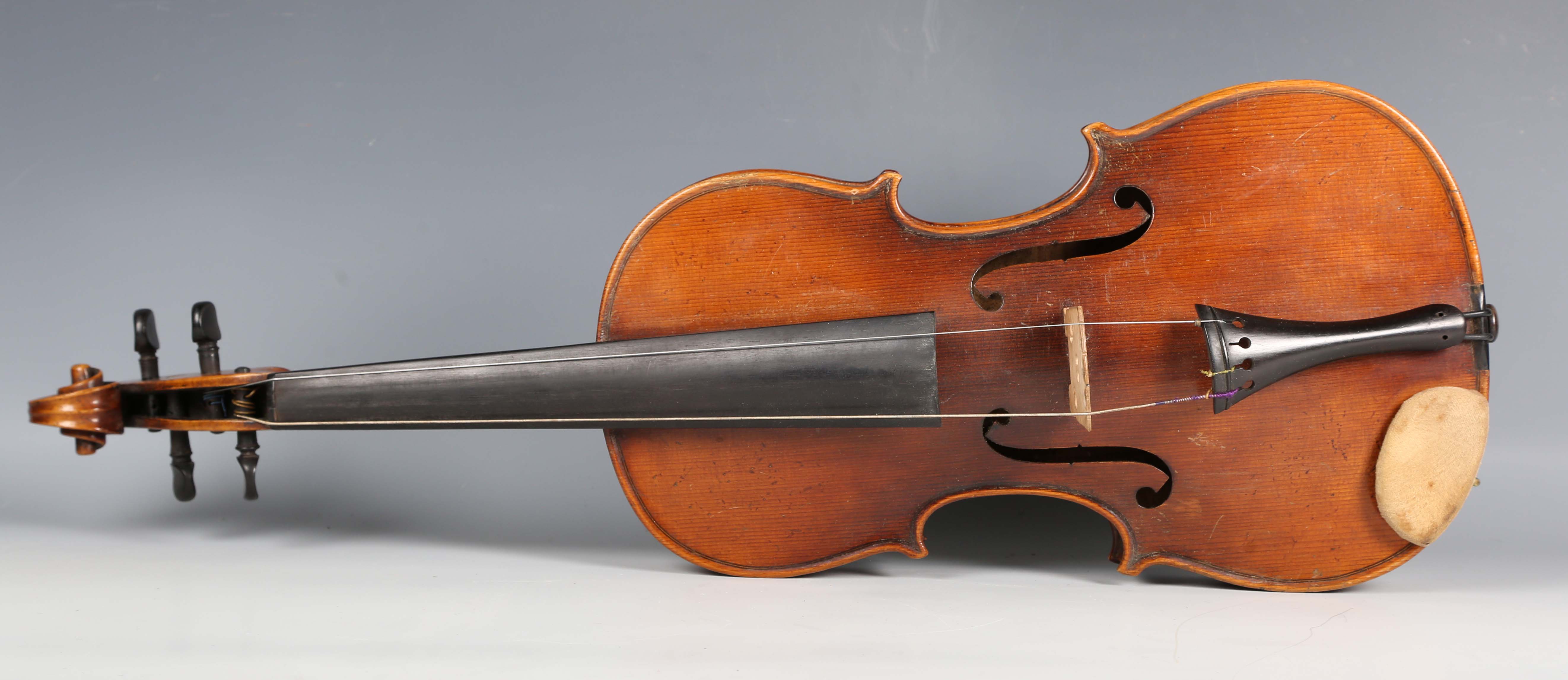 A violin with striped two-piece back, bearing interior label detailed 'Antonius Stradivarius...',