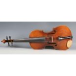 A violin with striped two-piece back, bearing interior label detailed 'Antonius Stradivarius...',