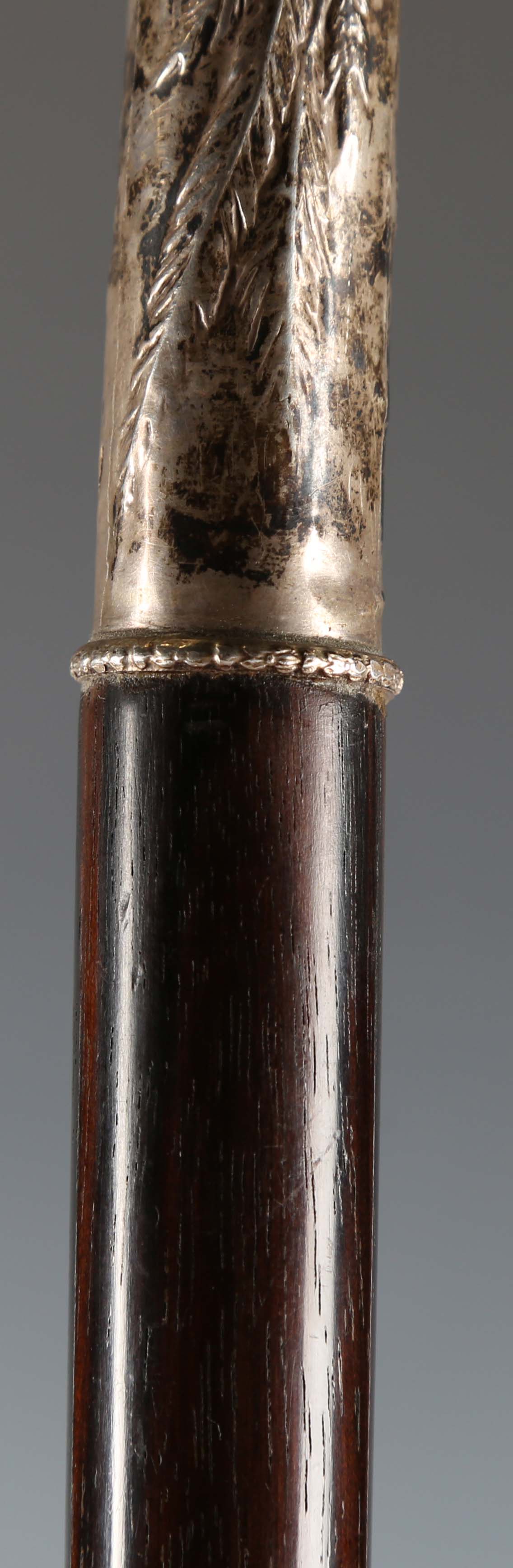 A late 20th century hardwood walking stick, the silver handle decorated in relief with a fox and - Image 5 of 11